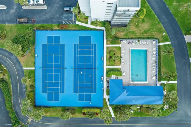 a view of a wooden door with a yard