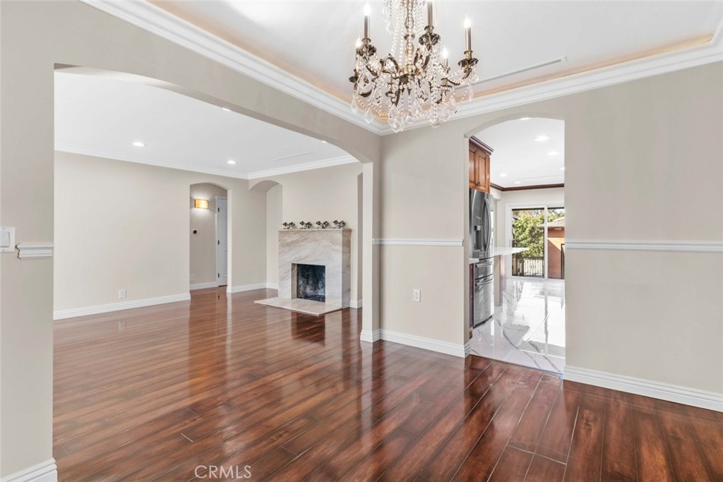 415 Birmingham Road Burbank, CA 91504 - Photo 13 of 61 a view of a livingroom with wooden floor and a kitchen space