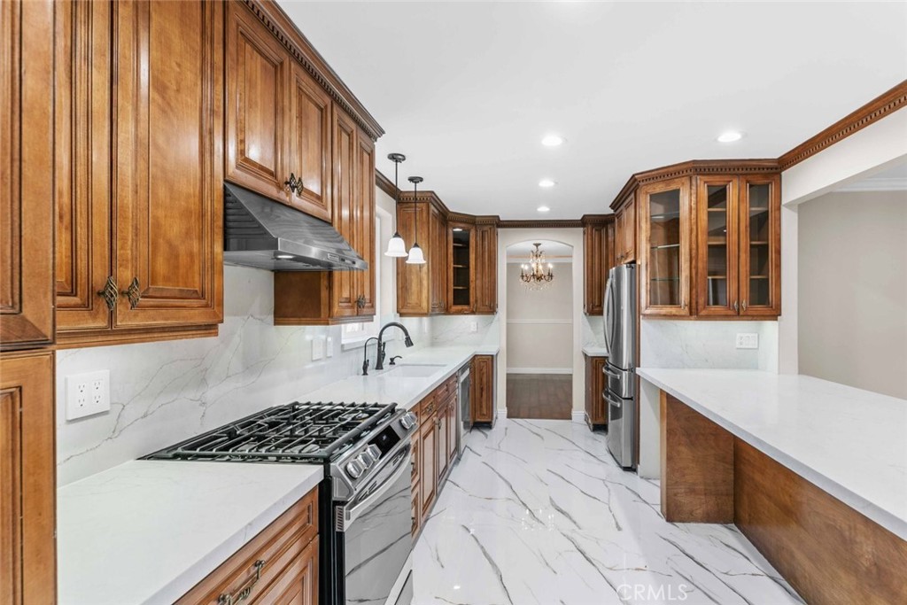 415 Birmingham Road Burbank, CA 91504 - Photo 14 of 61 a kitchen with a sink and a stove top oven