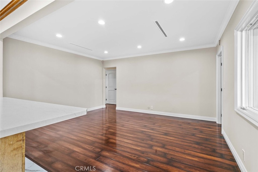 415 Birmingham Road Burbank, CA 91504 - Photo 21 of 61 an empty room with wooden floor and windows