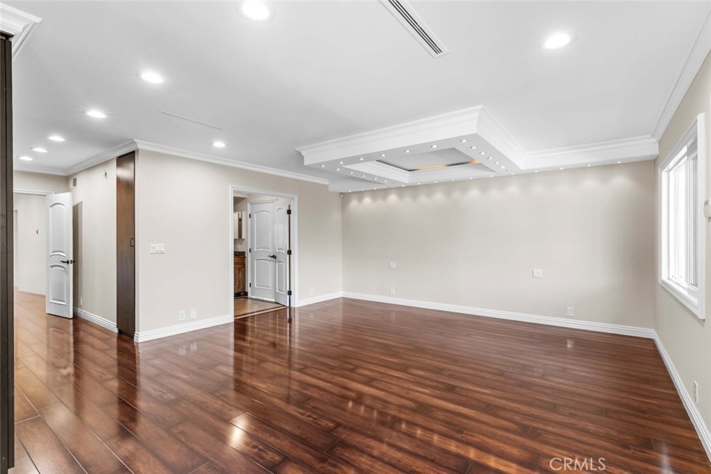 415 Birmingham Road Burbank, CA 91504 - Photo 25 of 61 an empty room with wooden floor and windows