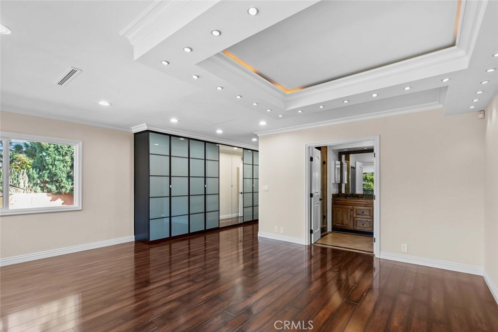 415 Birmingham Road Burbank, CA 91504 - Photo 27 of 61 a view of an empty room with wooden floor and a window