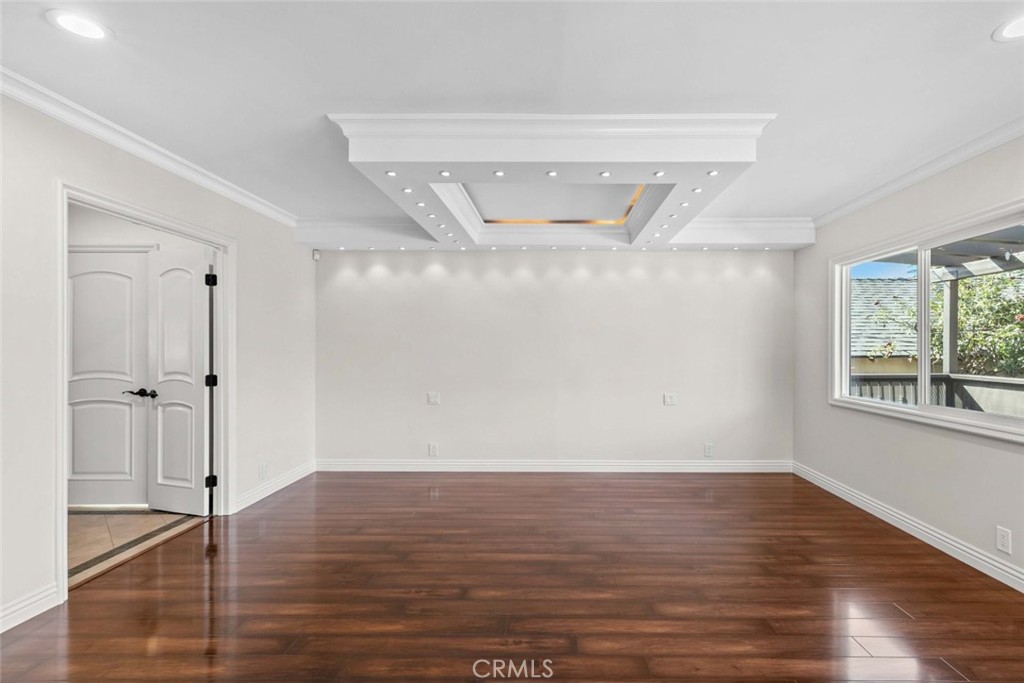 415 Birmingham Road Burbank, CA 91504 - Photo 28 of 61 a view of an empty room with wooden floor and a window