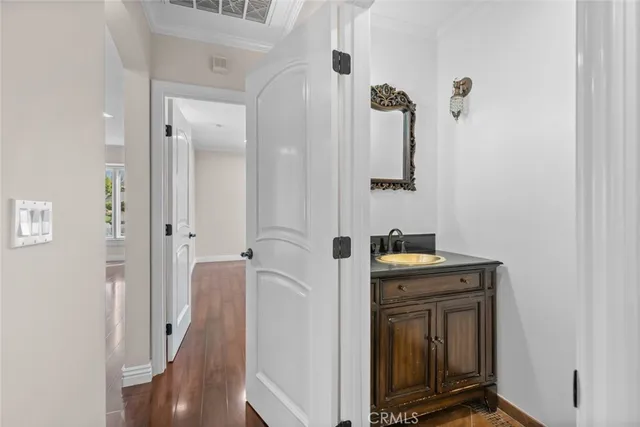 a view of a house with a wooden fence