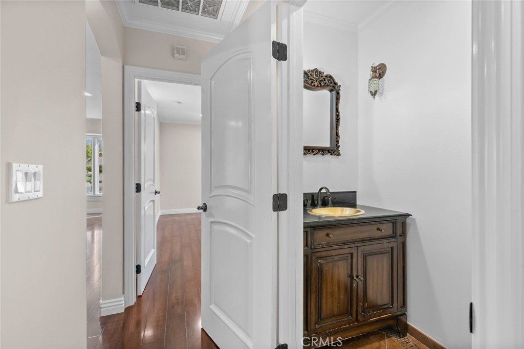 415 Birmingham Road Burbank, CA 91504 - Photo 37 of 61 a bathroom with a granite countertop sink a vanity and a mirror