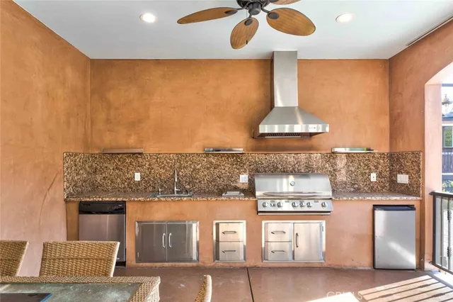 a kitchen with a sink stove and refrigerator