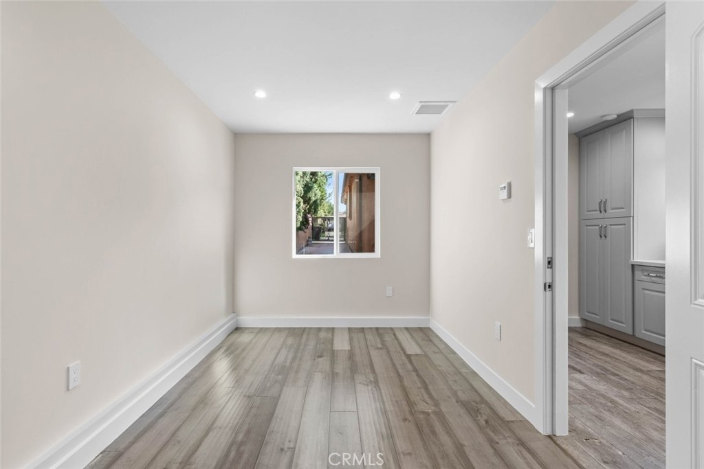 415 Birmingham Road Burbank, CA 91504 - Photo 57 of 61 wooden floor in an empty room with a window