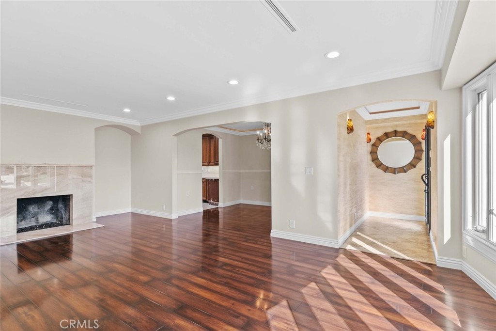 415 Birmingham Road Burbank, CA 91504 - Photo 7 of 61 a view of empty room with wooden floor and fireplace