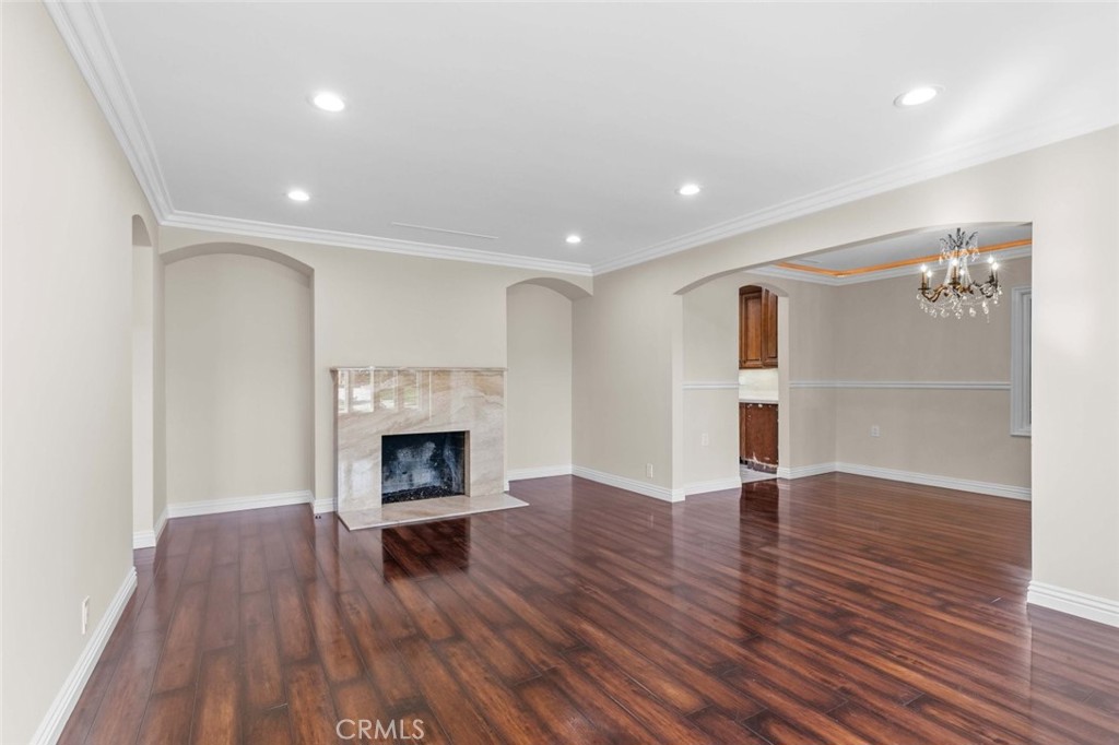 415 Birmingham Road Burbank, CA 91504 - Photo 10 of 61 a view of a livingroom with wooden floor and a fireplace