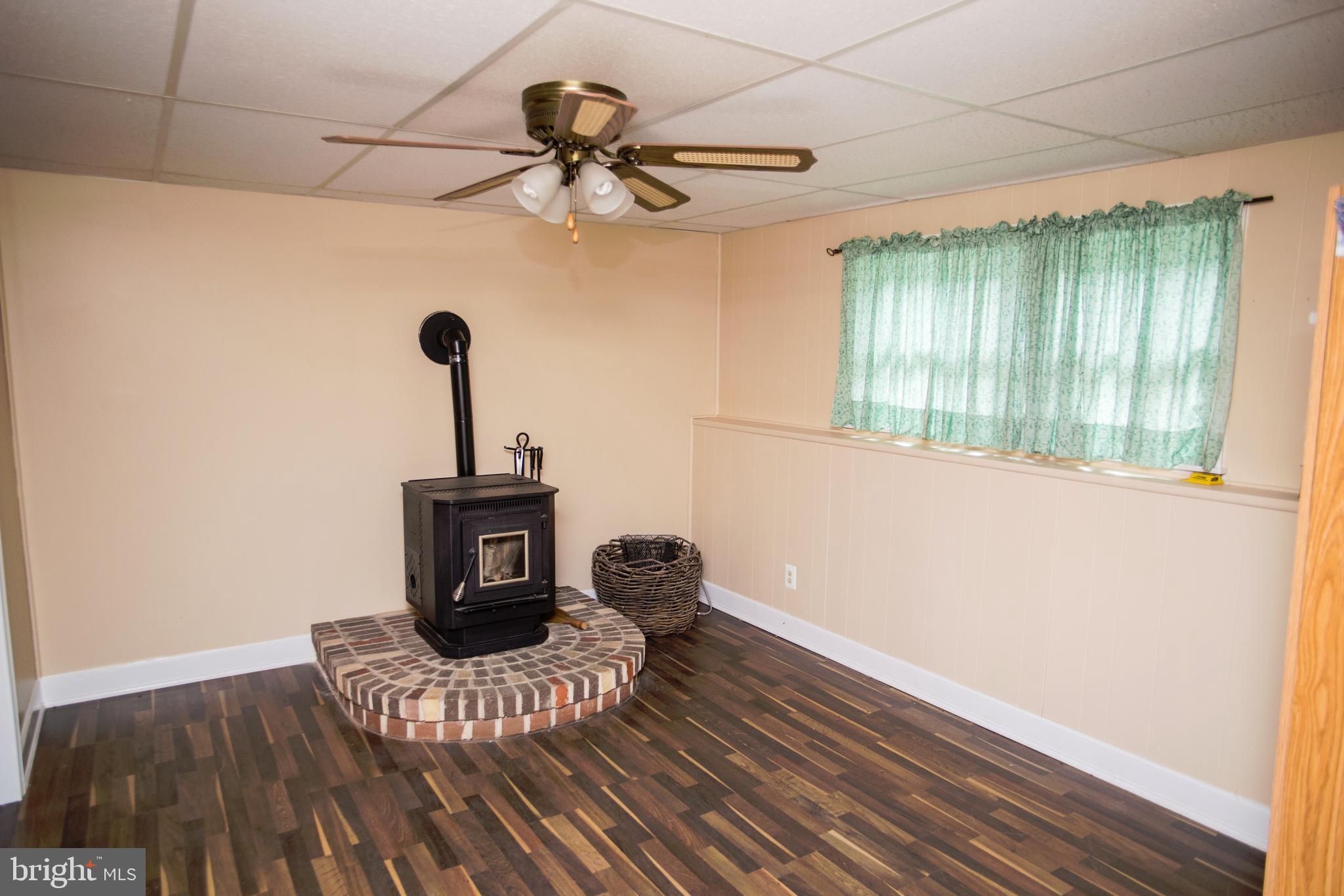 1761 Dr Jack Road Conowingo, MD 21918 - Photo 20 of 34 LL Family Room with Pellet Stove