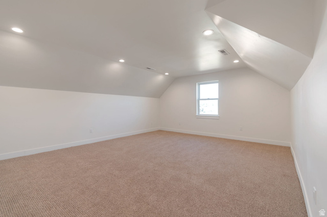1820 West Farmhouse Flats Road Peoa, UT 84061 - Photo 27 of 79 Spacious bonus room featuring an angled ceiling, recessed lighting, neutral carpeting, and a single window