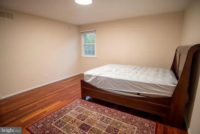 a bathroom with a sink toilet and mirror