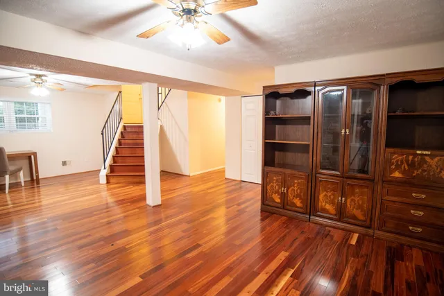 a bathroom with a sink vanity mirror and toilet