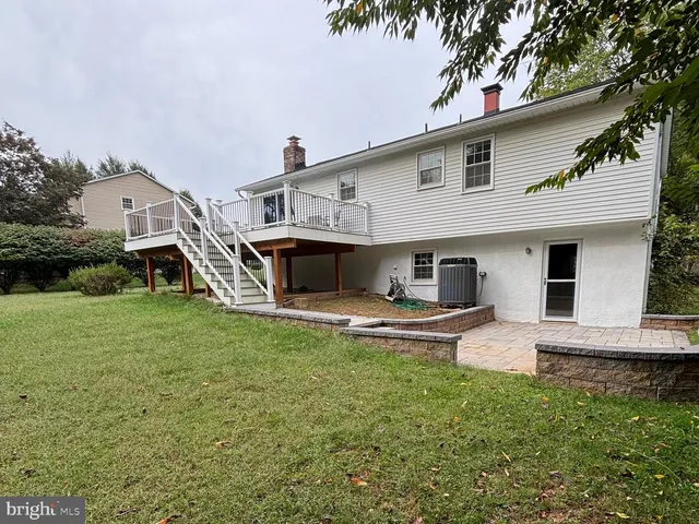 a view of a backyard with a sitting area