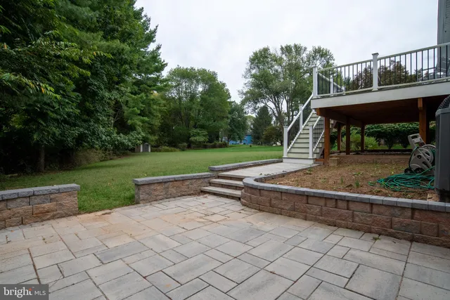 a view of a roof deck with wooden floor and fence