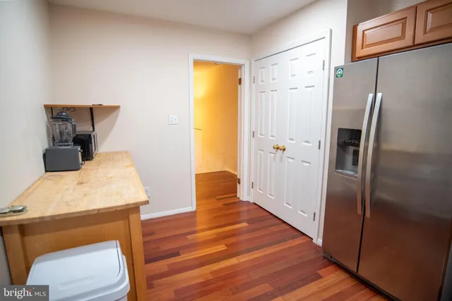 wooden floor in a room next to a window