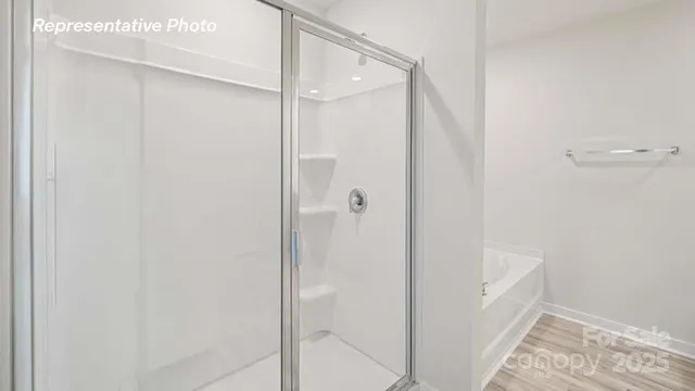 a spacious bathroom with a sink and a mirror