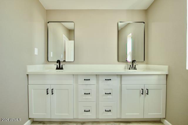1470 South Bowman Road Apache Junction, AZ 85119 - Photo 35 of 56 a bathroom with double vanity sinks and a mirror