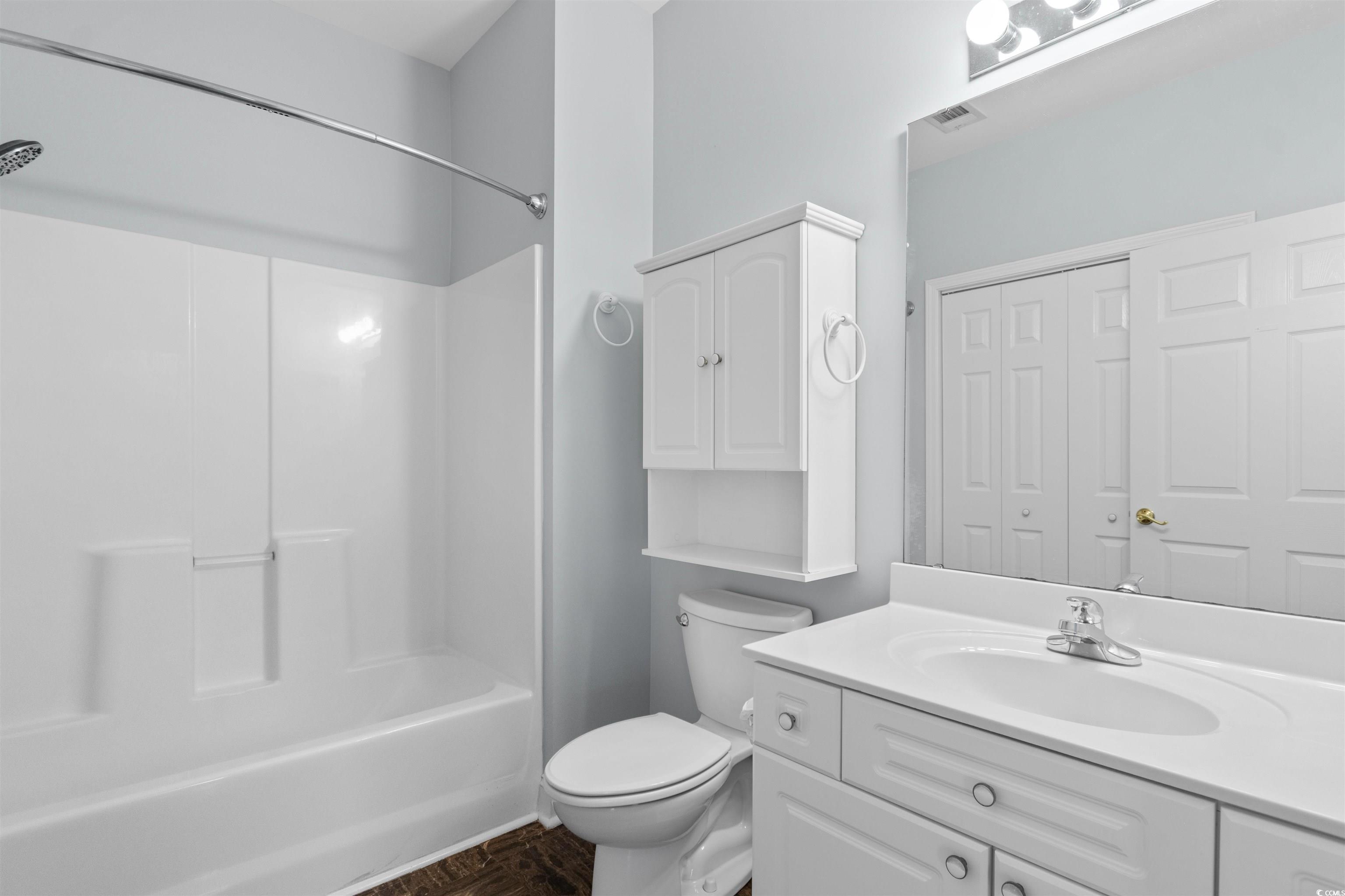 4430 Lady Banks Lane, Unit A2 Murrells Inlet, SC 29576 - Photo 22 of 31 Bathroom with vanity, bathing tub / shower combination, and a closet