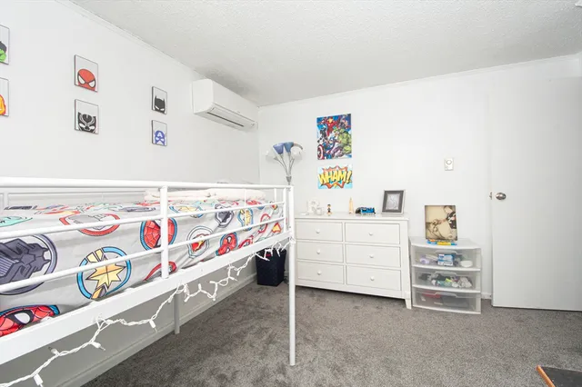a bathroom with a sink a toilet a vanity and shower