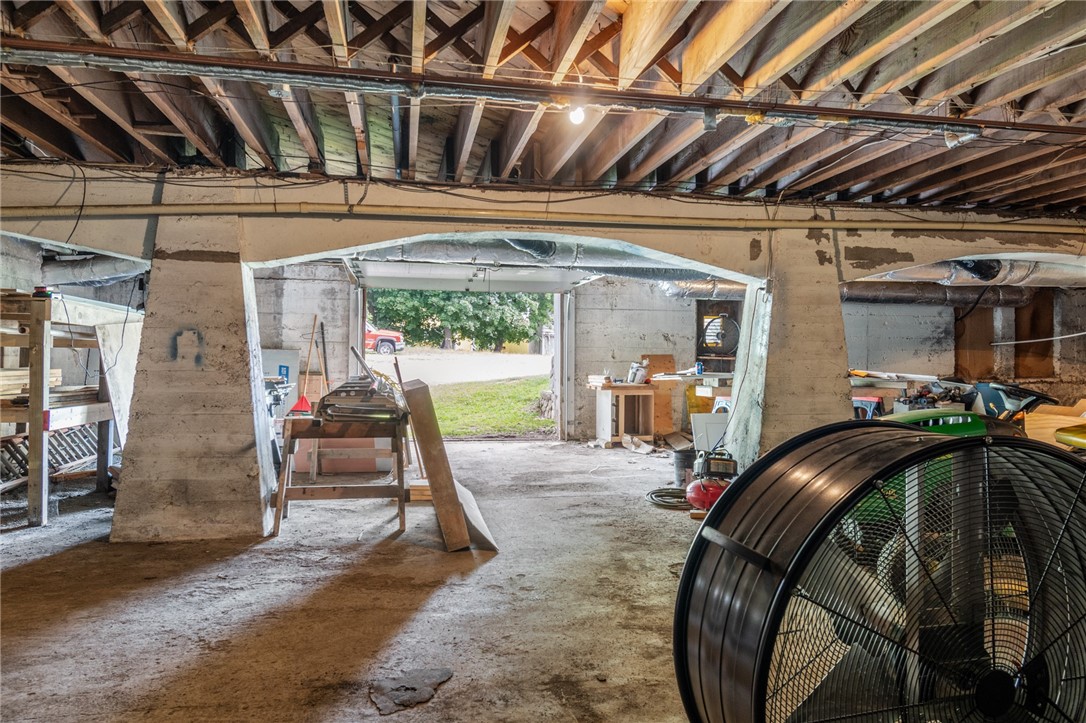 4075 Ridge Road Williamson, NY 14589 - Photo 24 of 37 The basement- has an overhead garage door and othe