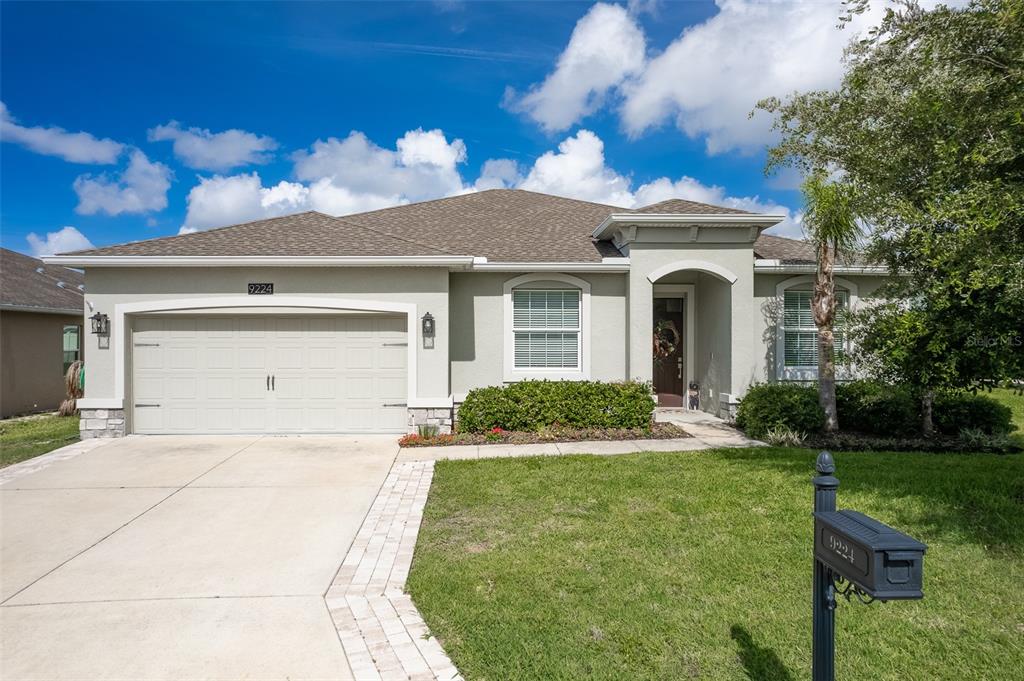 9224 Southwest 60th Ct Road Ocala, FL 34476 - Photo 1 of 55 a front view of a house with a yard