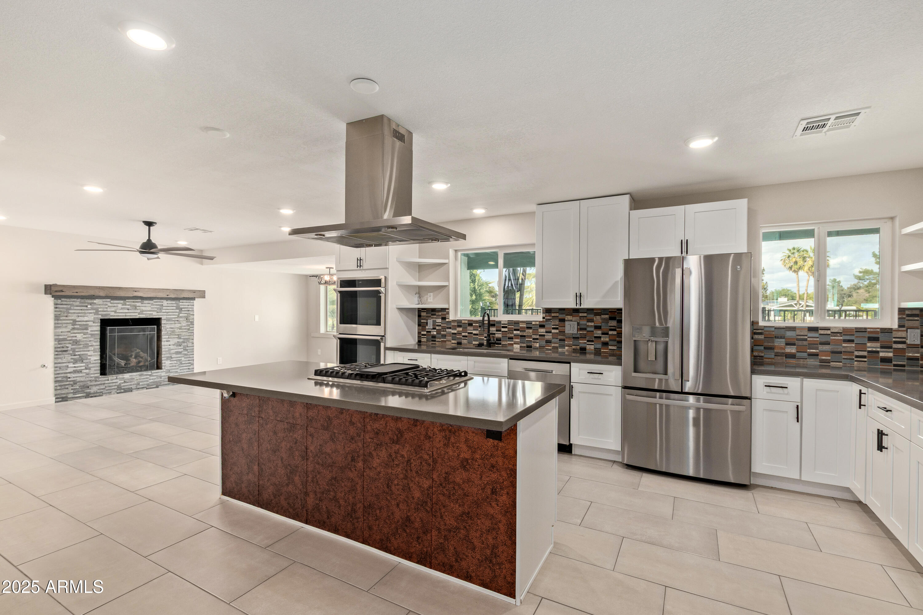 302 West Thunderbird Road Phoenix, AZ 85023 - Photo 11 of 44 a kitchen with kitchen island a counter top space appliances and cabinets