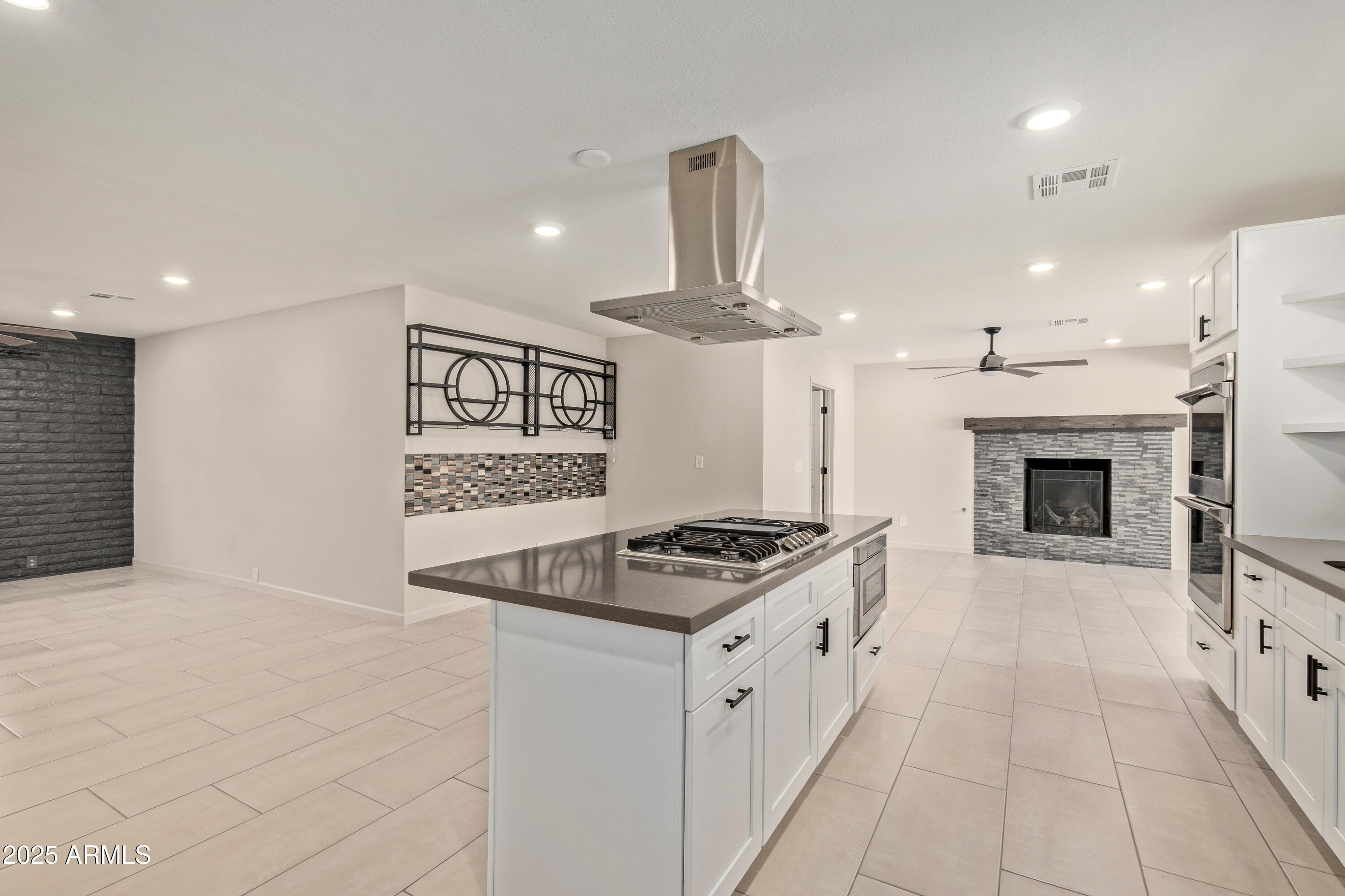 302 West Thunderbird Road Phoenix, AZ 85023 - Photo 13 of 44 a kitchen with stainless steel appliances granite countertop a stove and a sink