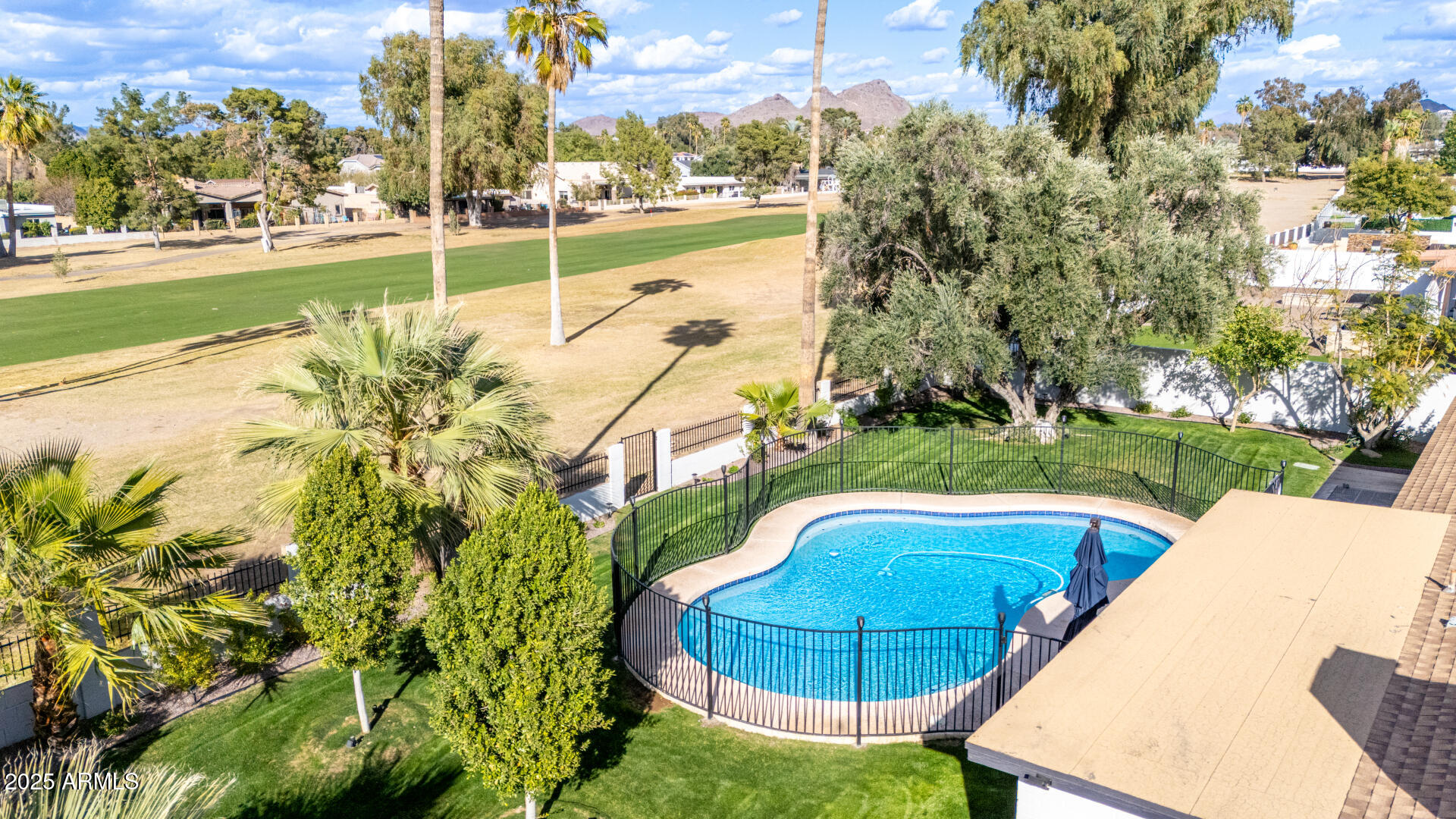 302 West Thunderbird Road Phoenix, AZ 85023 - Photo 36 of 44 a view of a swimming pool with a patio and garden