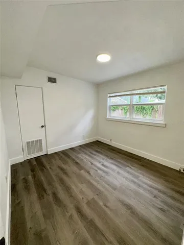 a view of wooden floor in a bathroom
