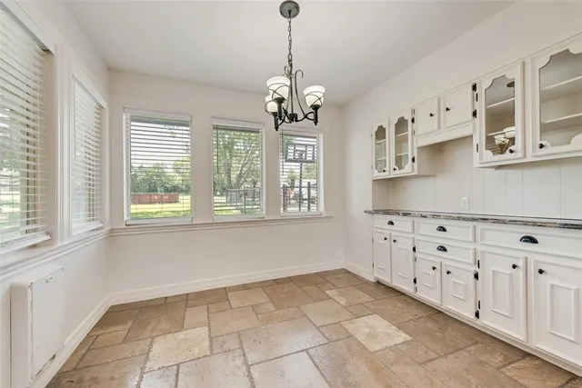 a view of a kitchen with cabinets