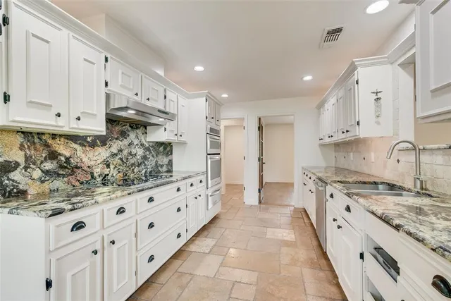 a large kitchen with cabinets