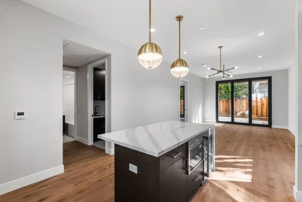 a view of a kitchen counter space and wooden floor