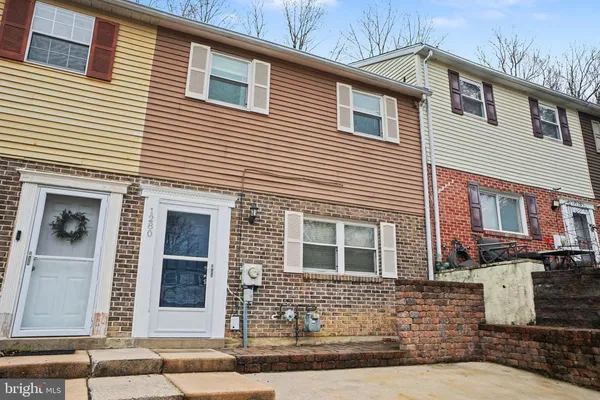 a living room with furniture pool table and a fireplace