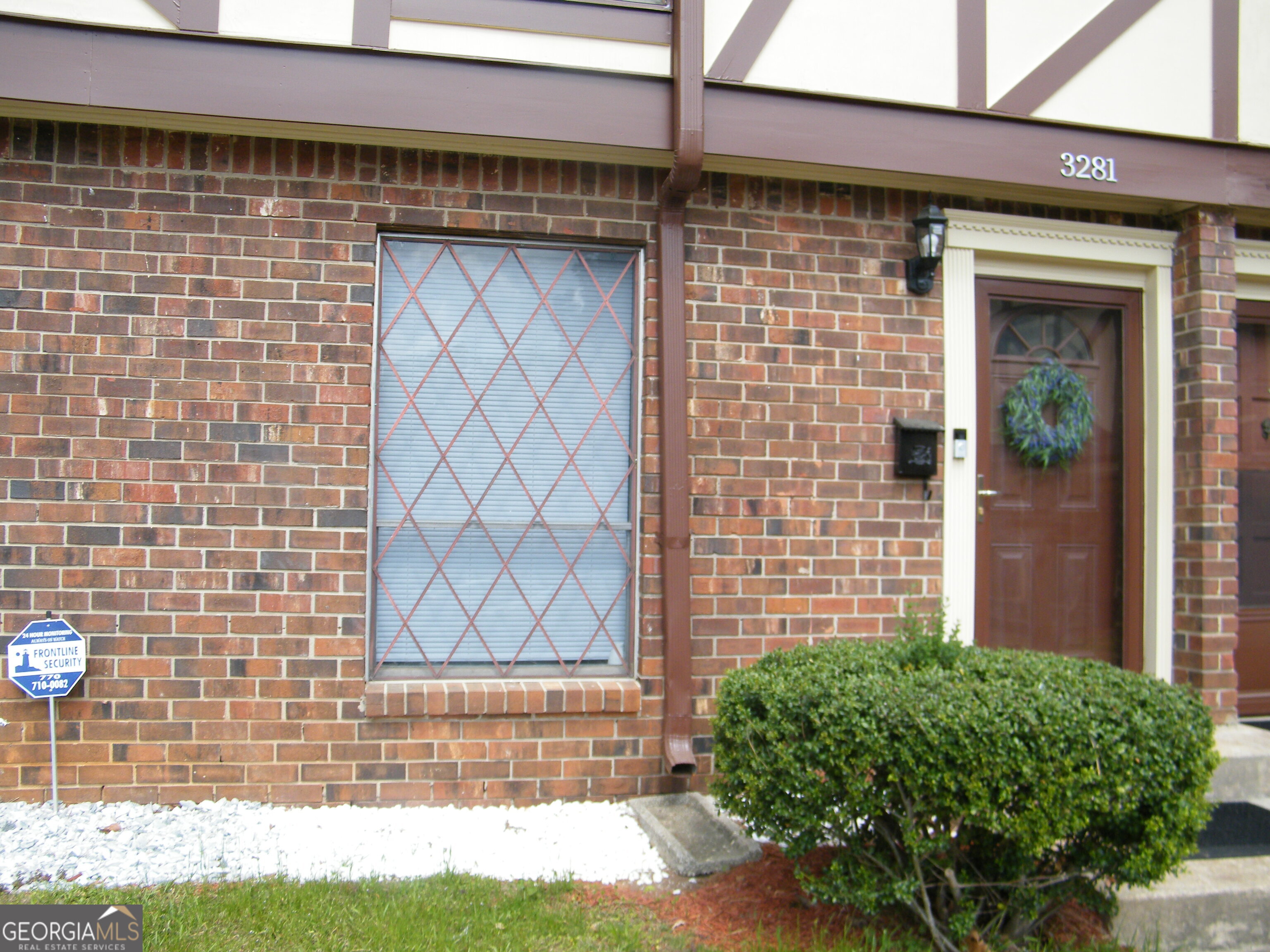 3281 Abbeywood Drive Decatur, GA 30034 - Photo 2 of 28 a view of a brick house with a yard