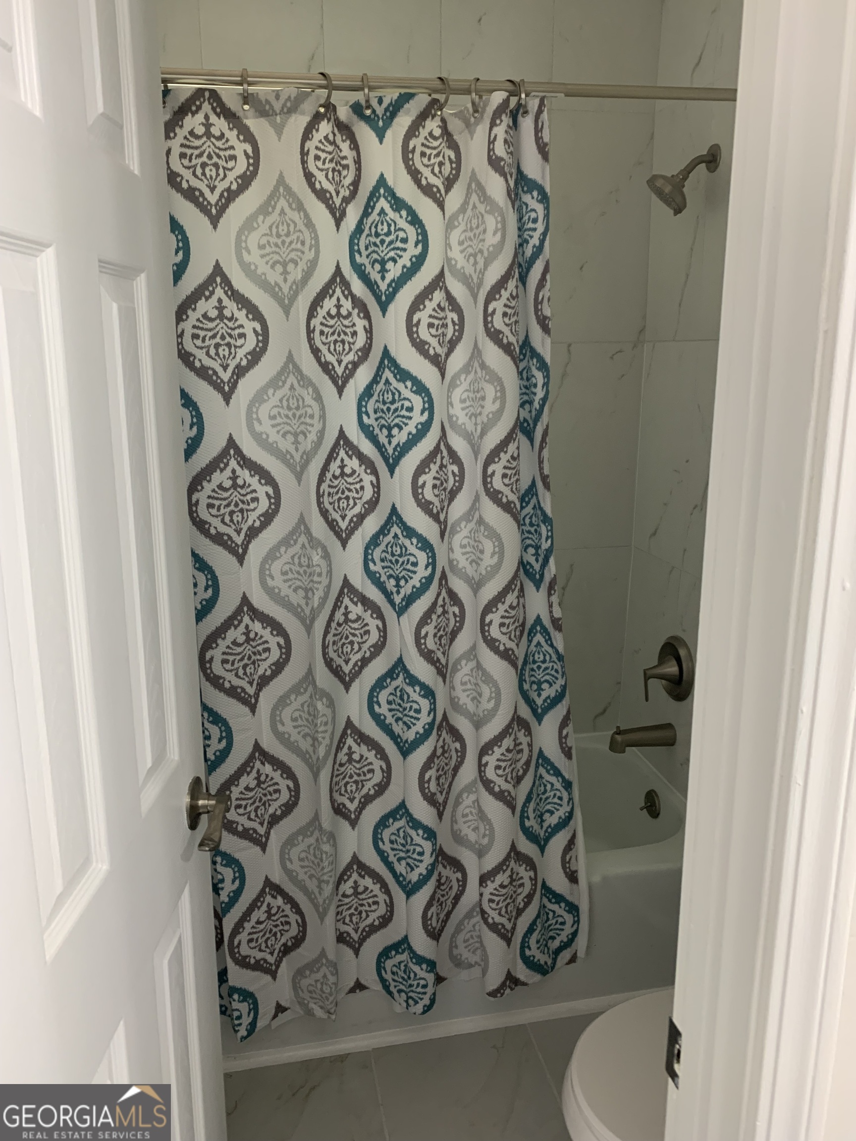3281 Abbeywood Drive Decatur, GA 30034 - Photo 22 of 28 a bathroom with a toilet and a shower curtain