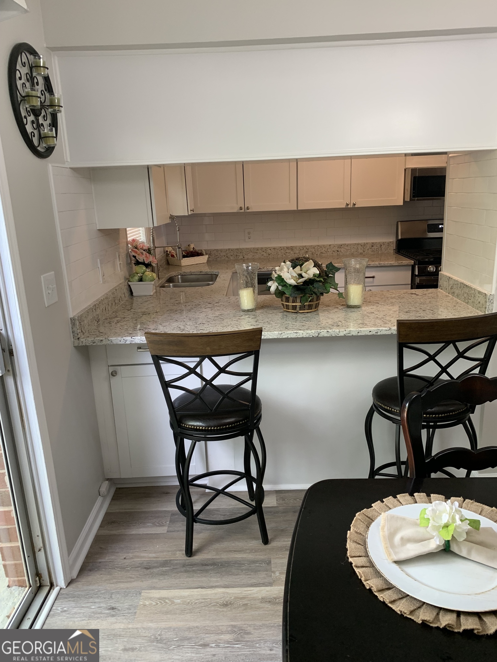 3281 Abbeywood Drive Decatur, GA 30034 - Photo 24 of 28 a kitchen with a table chairs and a stove