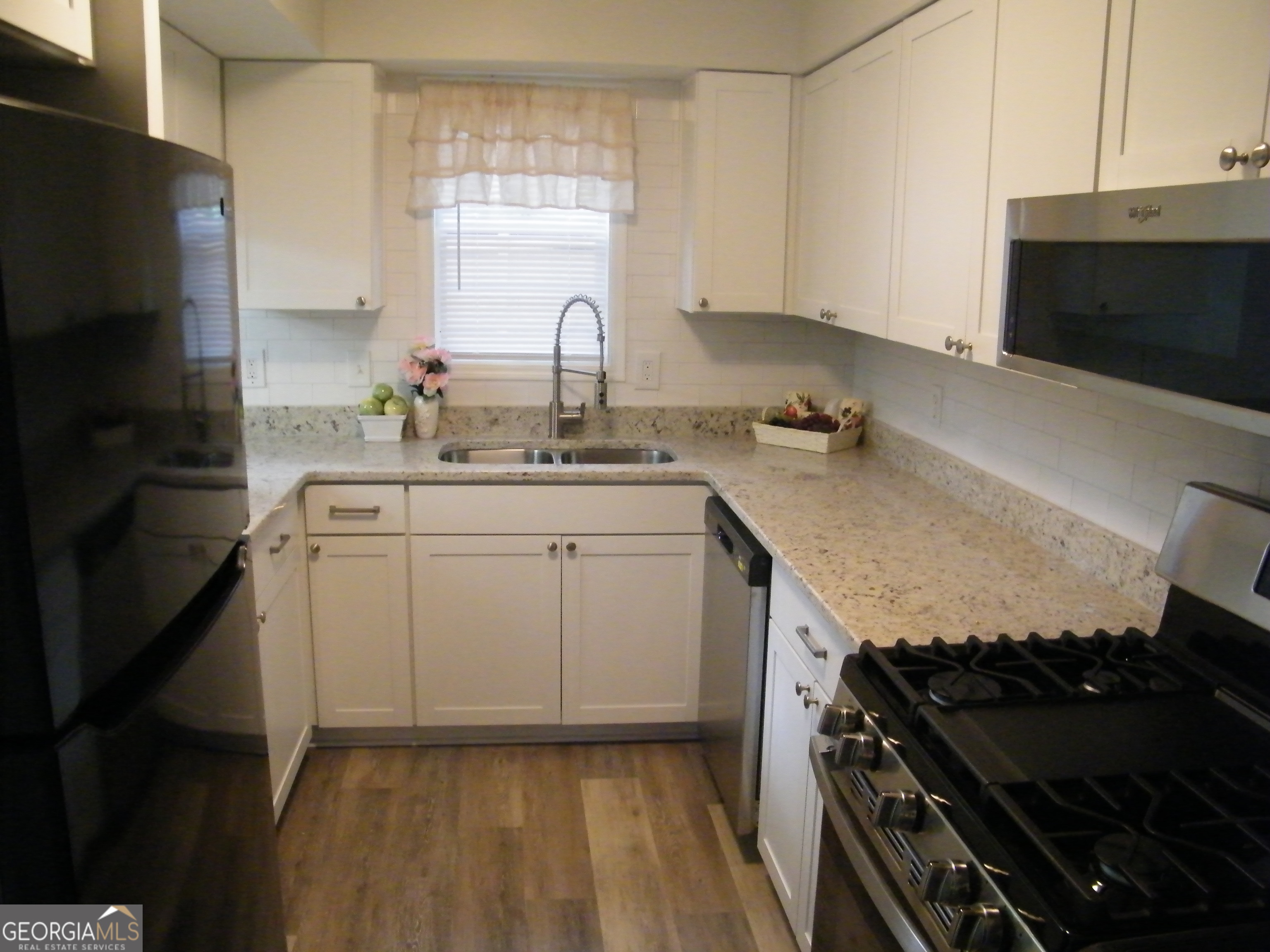 3281 Abbeywood Drive Decatur, GA 30034 - Photo 7 of 28 a kitchen with a sink stove and microwave