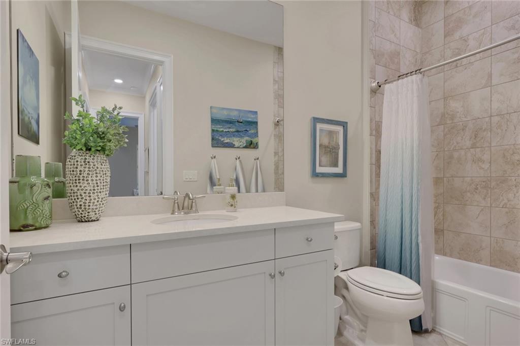 5752 Elbow Avenue Naples, FL 34113 - Photo 12 of 38 Bathroom with vanity and shower / bath combo