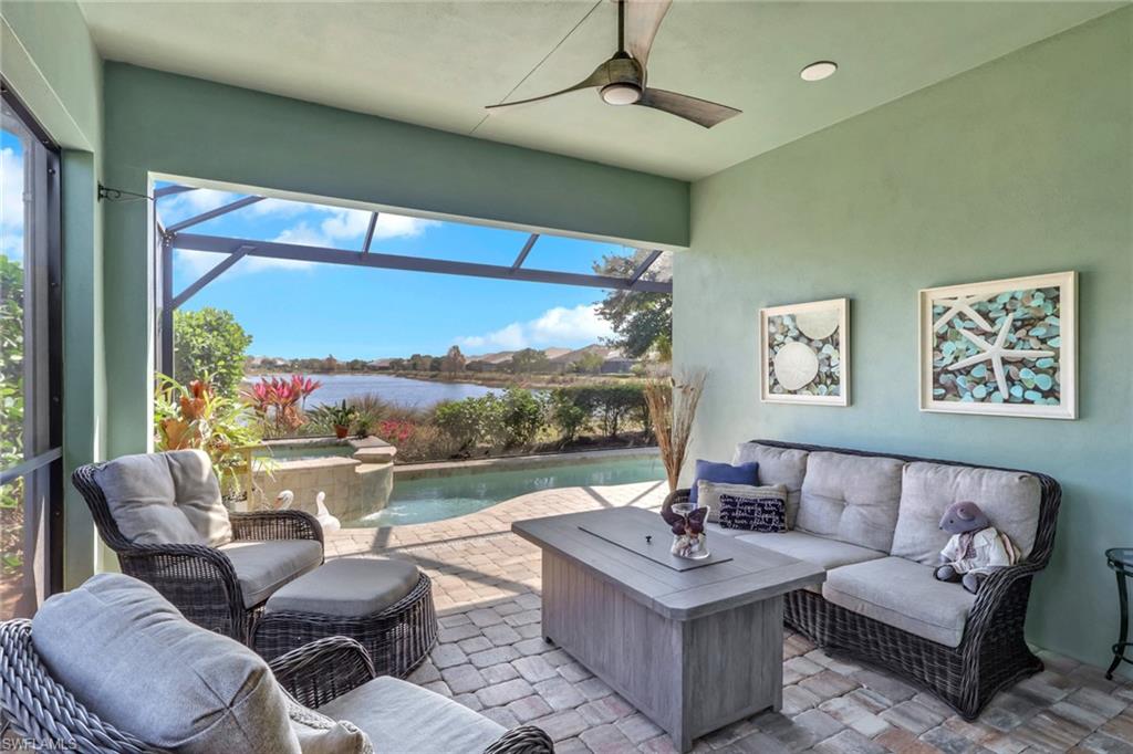5752 Elbow Avenue Naples, FL 34113 - Photo 24 of 38 View of patio featuring an outdoor lounge area, glass enclosure, a sunroom, a jacuzzi, and ceiling fan