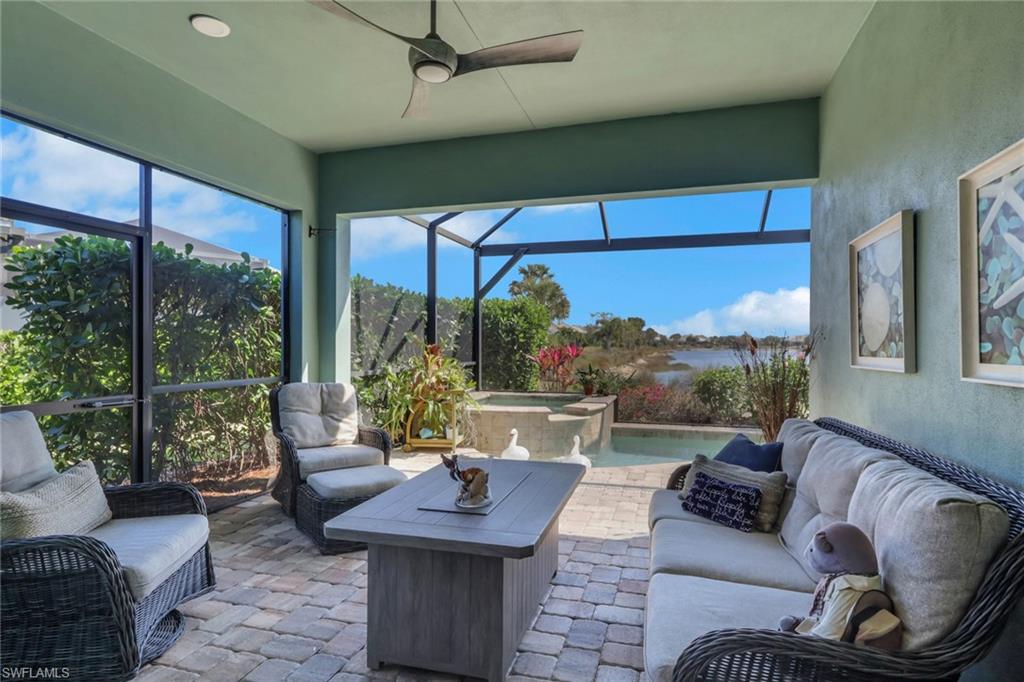 5752 Elbow Avenue Naples, FL 34113 - Photo 26 of 38 Sunroom with an outdoor hangout area, ceiling fan, a hot tub, and a patio area