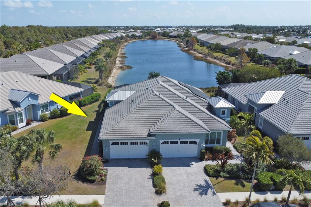 5752 Elbow Avenue Naples, FL 34113 - Photo 3 of 38 Aerial view of residential area with a large body of water