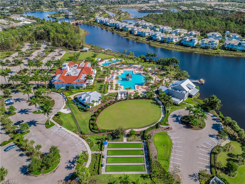 5752 Elbow Avenue Naples, FL 34113 - Photo 36 of 38 Aerial overview of property's location with nearby suburban area and a large body of water