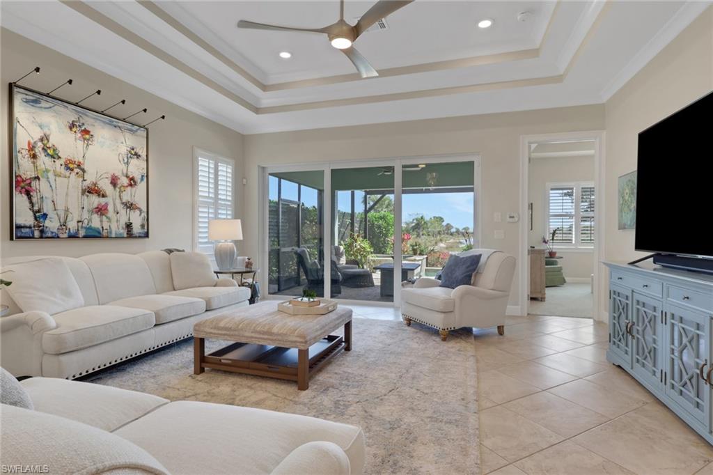 5752 Elbow Avenue Naples, FL 34113 - Photo 4 of 38 Living area with a ceiling fan, light tile patterned floors, ornamental molding, and recessed lighting