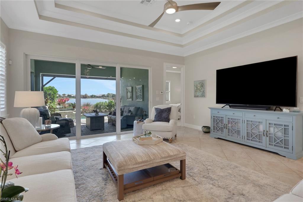 5752 Elbow Avenue Naples, FL 34113 - Photo 6 of 38 Living room featuring ceiling fan, light tile patterned floors, and ornamental molding