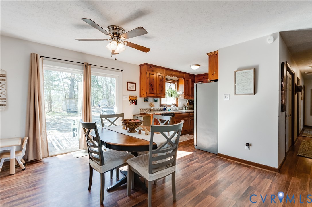 445 Poplar Road Aylett, VA 23009 - Photo 11 of 36 a view of a dining room with furniture window and wooden floor