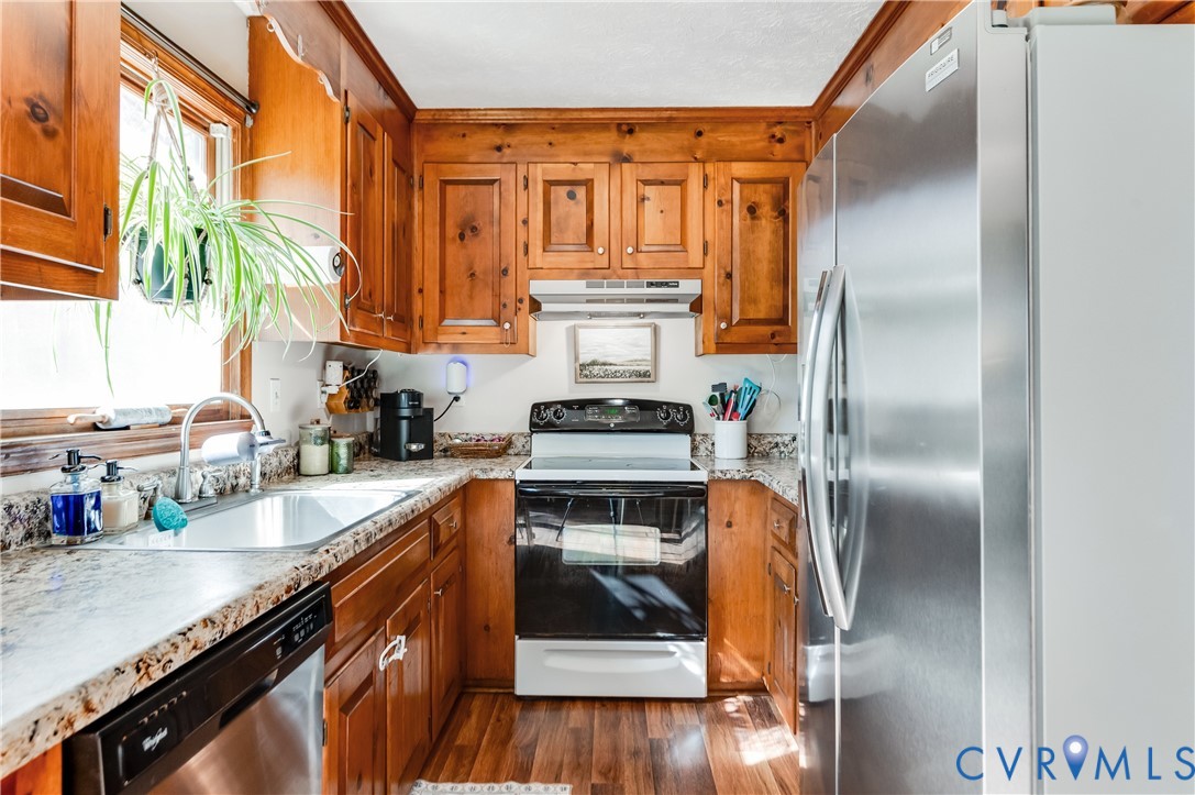 445 Poplar Road Aylett, VA 23009 - Photo 15 of 36 a kitchen with a refrigerator and a sink