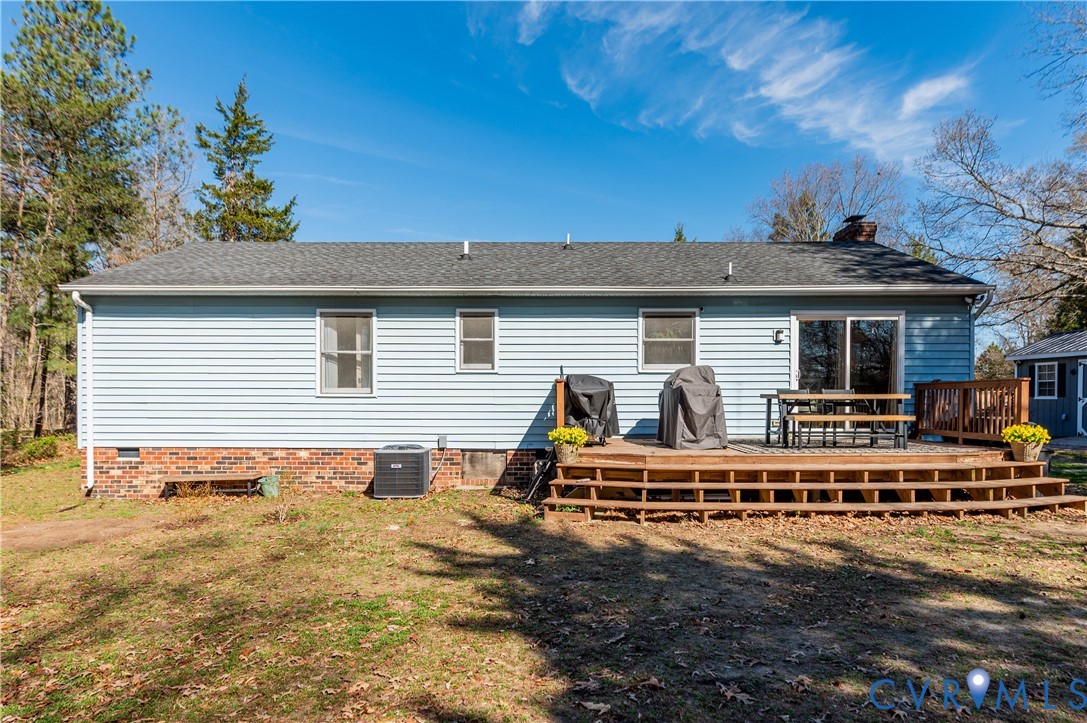 445 Poplar Road Aylett, VA 23009 - Photo 27 of 36 a view of a house with backyard and sitting area