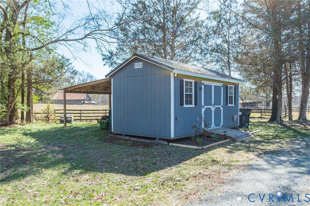 445 Poplar Road Aylett, VA 23009 - Photo 29 of 36 a view of a house with a yard