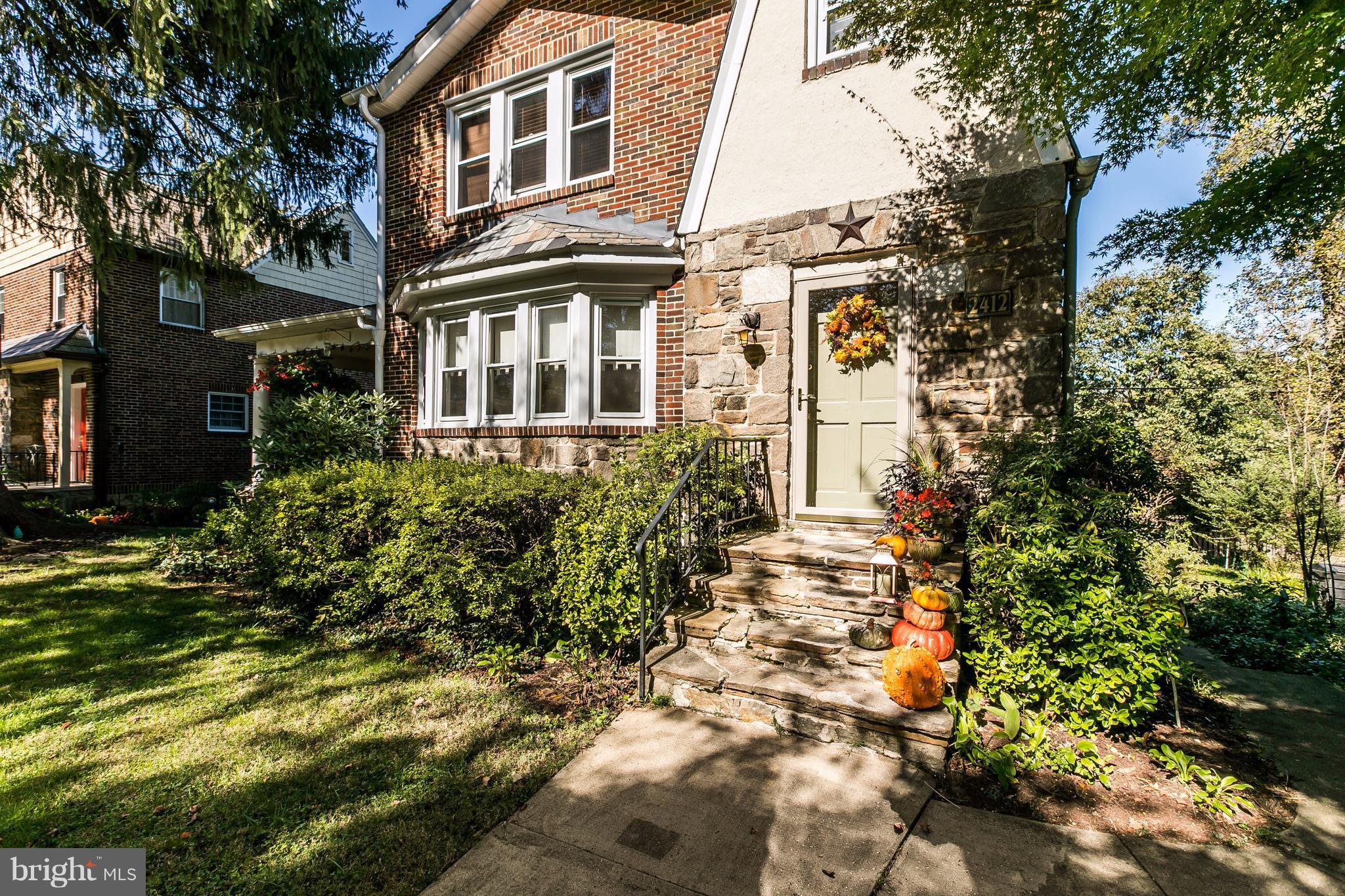 2412 Brambleton Road Baltimore, MD 21209 - Photo 1 of 30 a view of a big yard with plants and large trees
